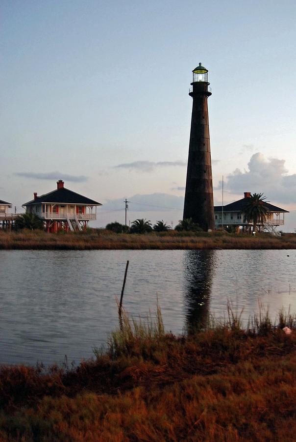 Sunrise over Port Bolivar Tx Lighthouse Photograph by Anna Johnson