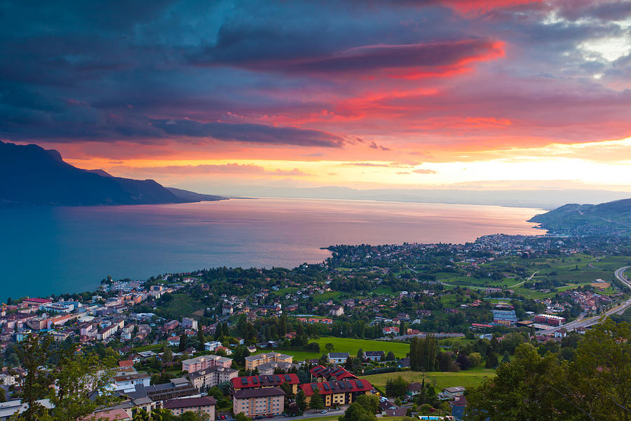 Sunrise over the cities of Montreux and Lausanne Photograph by Xenotar