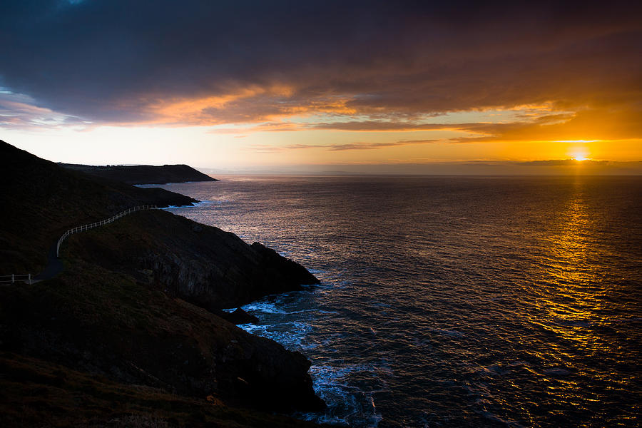 Sunrise over the Wales Coast Path Photograph by Paul Cowan