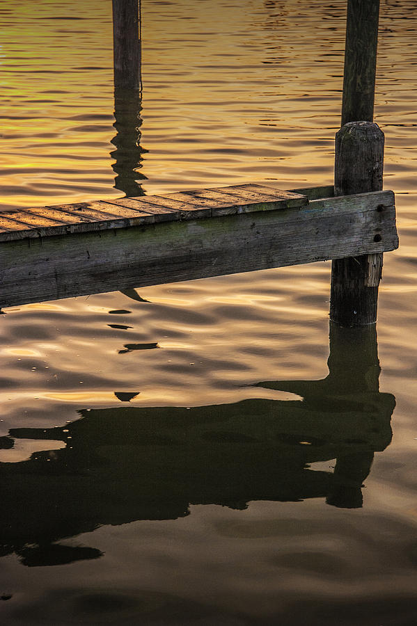 Nature Photograph - Sunrise Reflections on the Water by a Boat Dock by Randall Nyhof