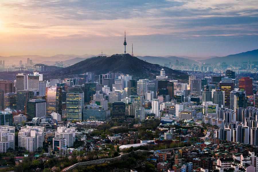 Sunrise scene of Seoul downtown city skyline, Aerial view of N Seoul Tower at Namsan Park in twilight sky in morning. The best viewpoint and trekking from inwangsan mountain in Seoul city, South Korea Photograph by Mongkol Chuewong