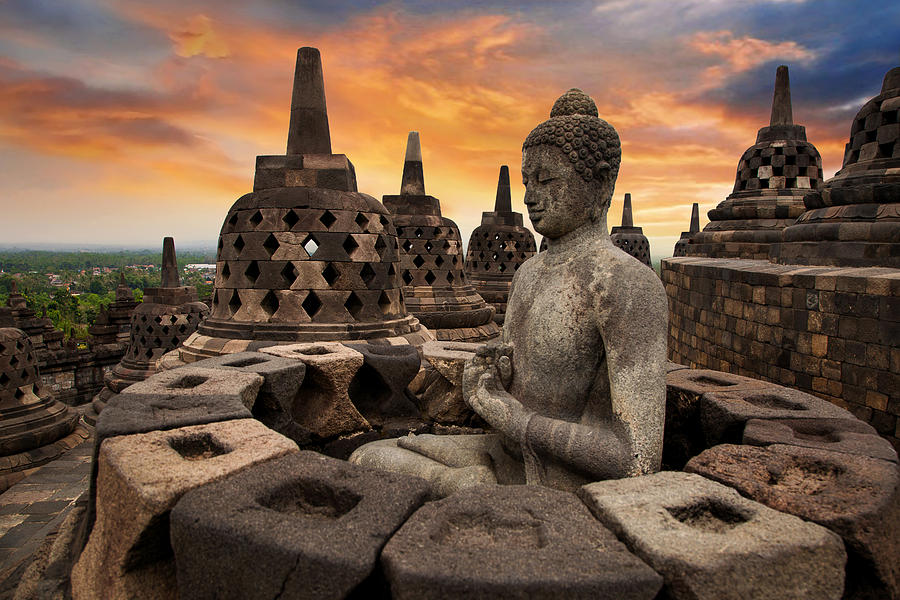 Sunrise with a Buddha Statue with the Hand Position of Dharmachakra Mudra in Borobudur, Magelang, Central Java, Indonesia Photograph by Artie Photography (Artie Ng)