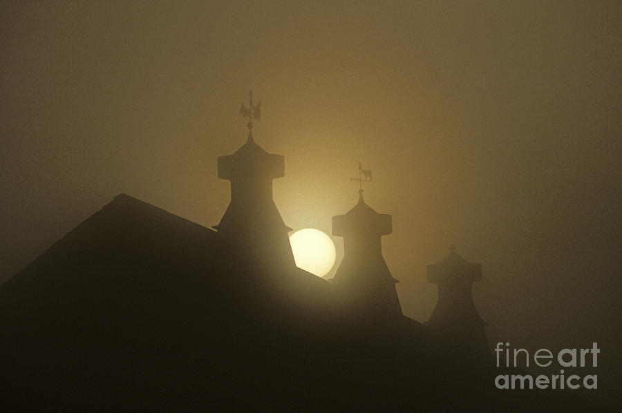 Sunrise with silhouetted cupolas on barn Photograph by Jim Corwin