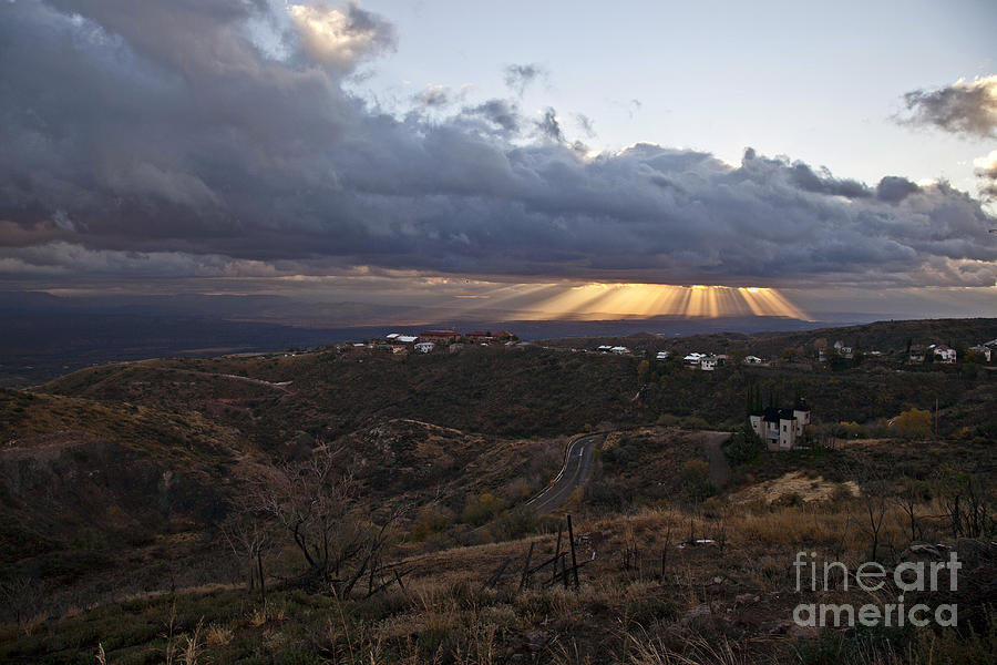 Suns rays after sunrise from Jerome Arizona Photograph by Ron Chilston