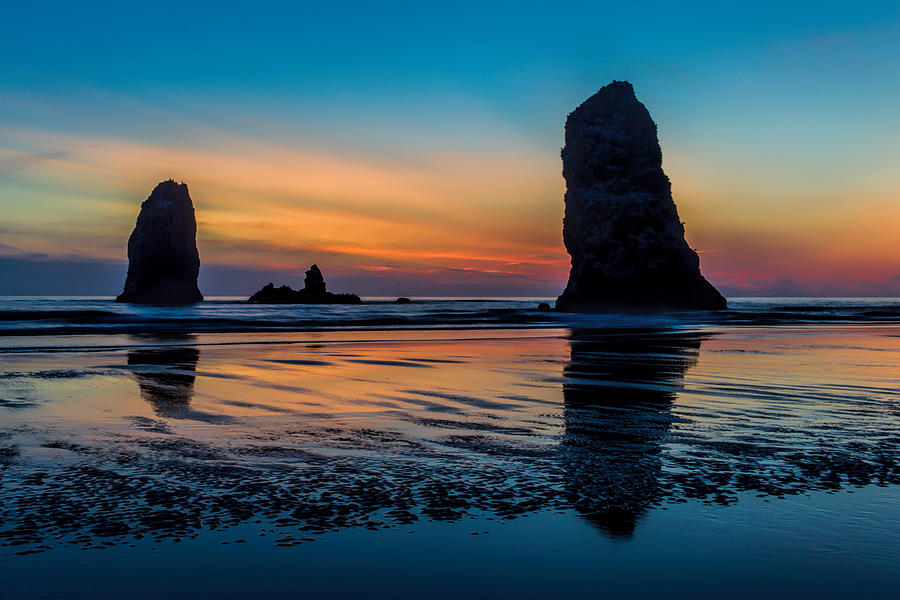 Sunset at Cannon Beach Photograph by Mike Centioli