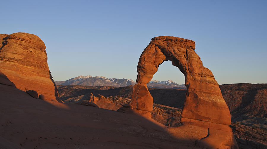 Sunset at Delicate Arch Photograph by Brian Kamprath