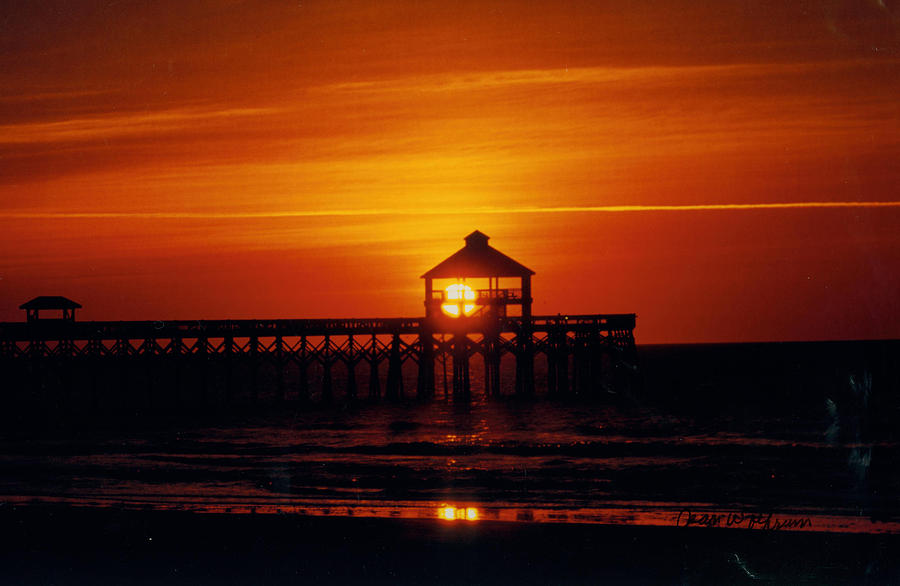 Sunset at Folly Beach Photograph by Jean Wolfrum