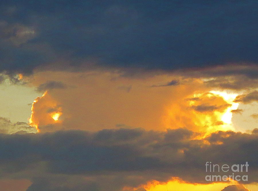 Sunset between horizontally layered clouds Photograph by Robert Birkenes