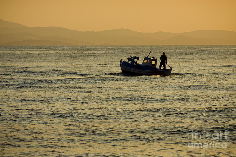 Sunset boat Photograph by Raimond Klavins