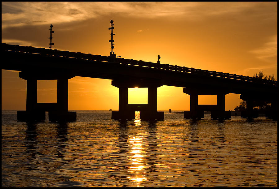 Tropical Sunset Behind Bridge Photograph by Ginger Wakem