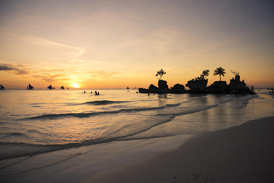 Sunset in famous Willys Rock, Boracay beach. Photograph by Volanthevist