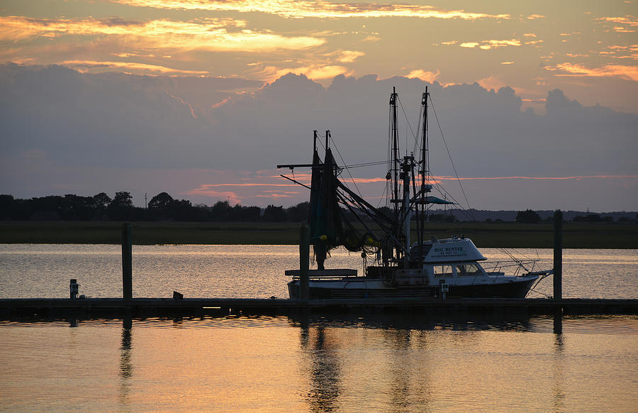 Sunset on Jekyll Island with Docked Boat Photograph by Bruce Gourley