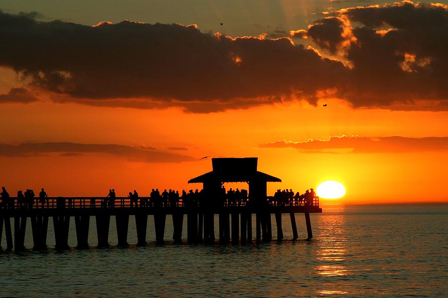 Sunset on Naples Pier Photograph by Rick Locke - Out of the Corner of My Eye