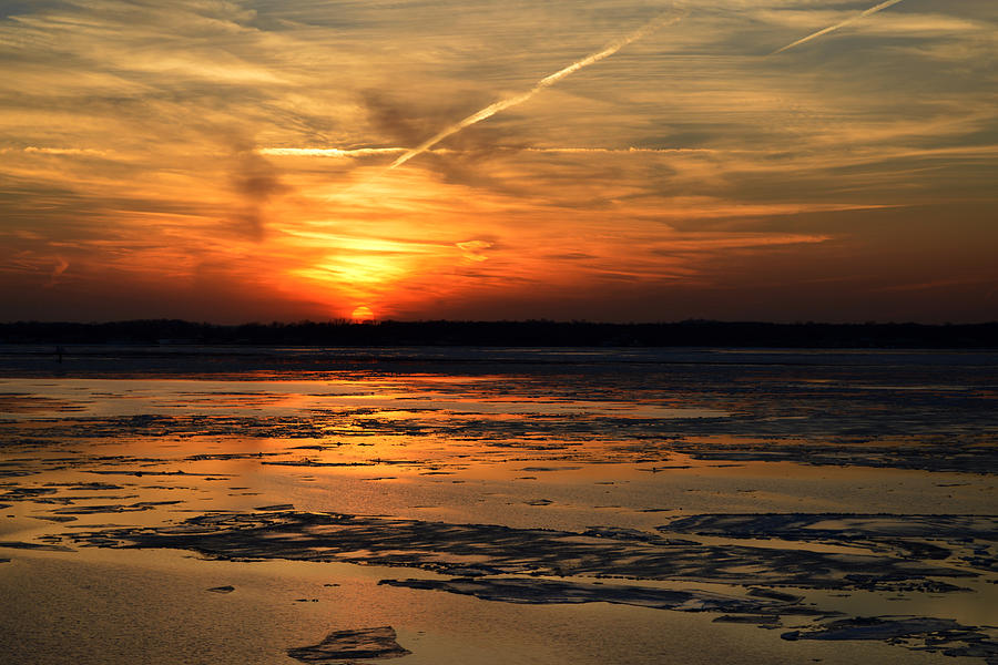 Sunset over a Frozen Chesapeake Bay Photograph by Bill Swartwout