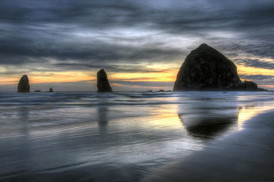 Sunset over Haystack Rock in Cannon Beach Photograph by David Gn