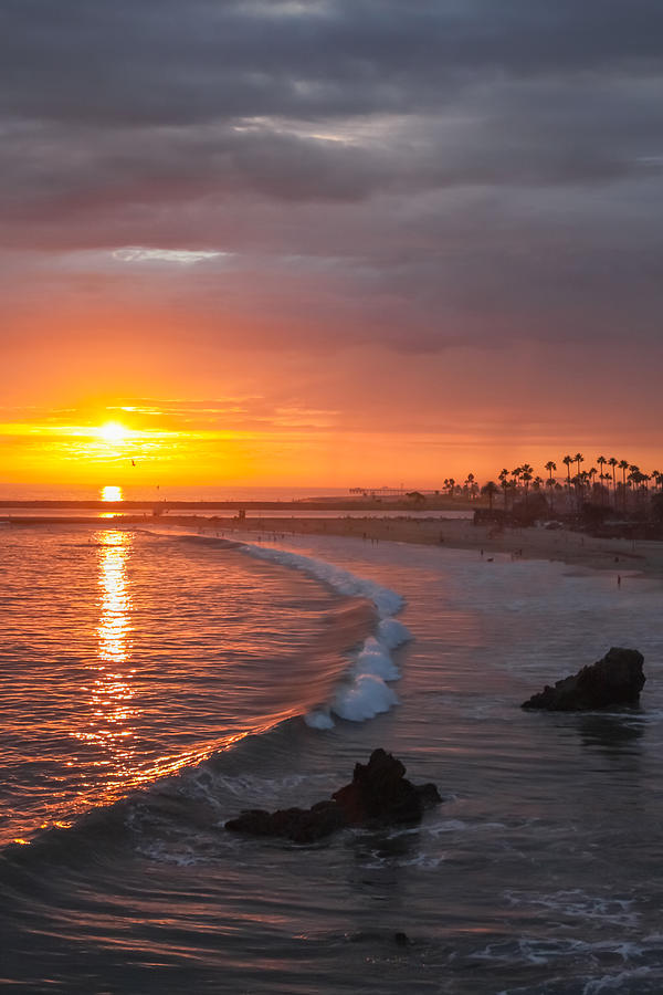 Sunset over Newport Beach Jetty Photograph by Cliff Wassmann