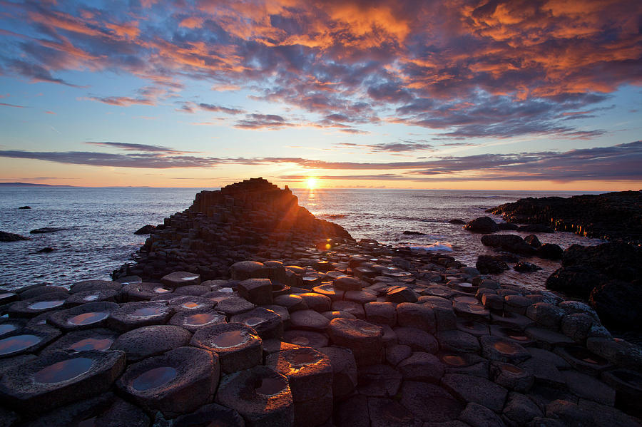 Sunset Over The Giants Causeway Photograph by Gareth Mccormack Sunset Over The Giants Causeway Photograph by Gareth Mccormack