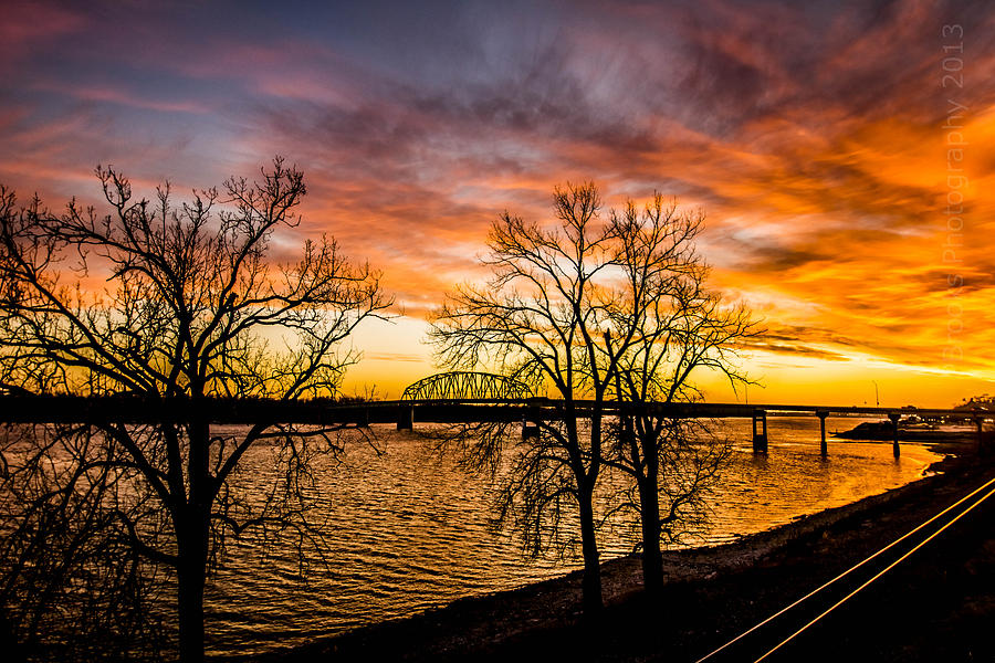 Sunset over the Mississippi River Photograph by Paul Brooks