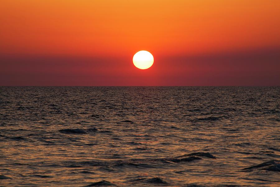 Sunset Over The Ocean Photograph by Jim Edds