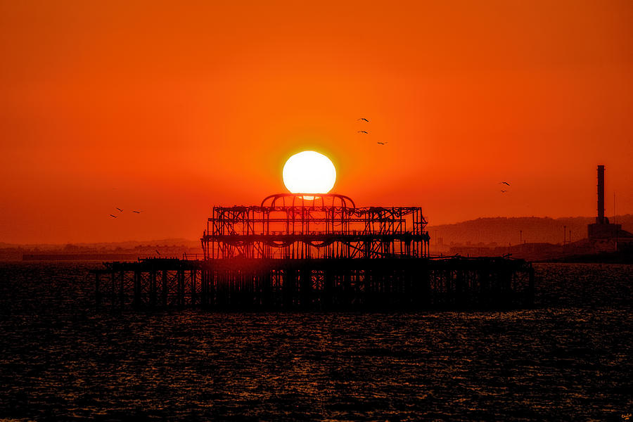Sunset Over the Remains Of The West Pier Photograph by Chris Lord