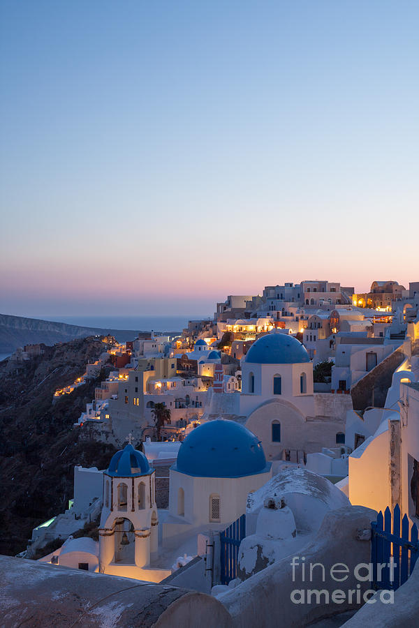 Greek Photograph - Sunset over the village of Oia - Santorini - Greece by Matteo Colombo
