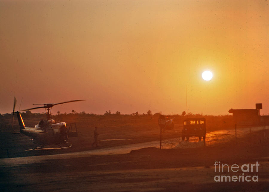 Sunset Photograph - Sunset over UH-1 Huey Helicopter Camp Enari Vietnam 1968 by Monterey County Historical Society