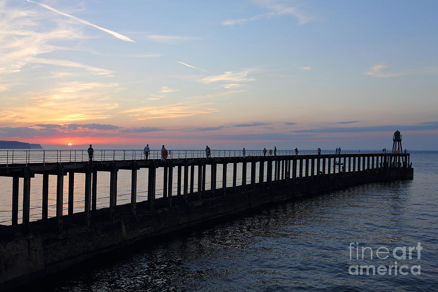 Sunset over Whitby Pier Yorkshire England UK Photograph by Julia Gavin