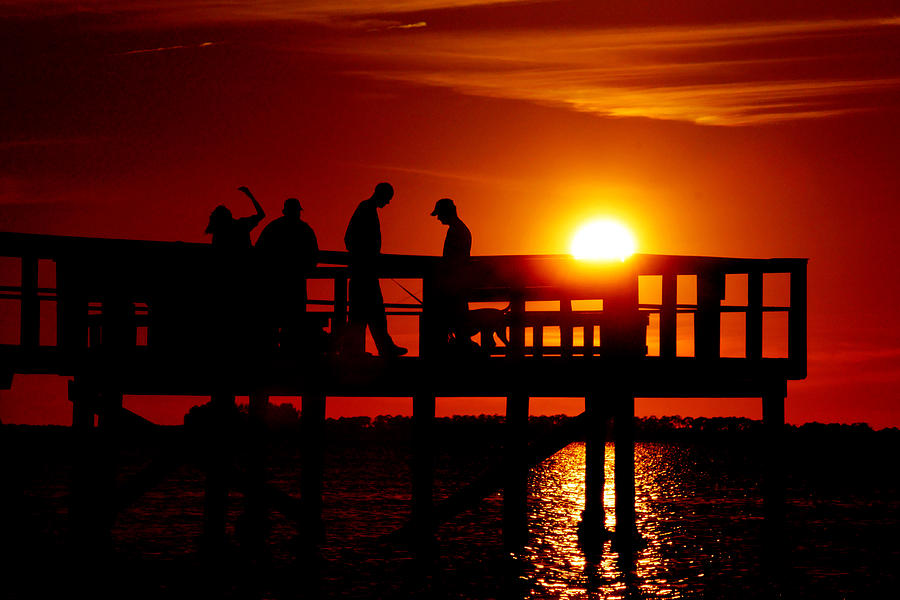 Sunset Silhouettes at Crystal Beach Pier Photograph by Daniel Woodrum