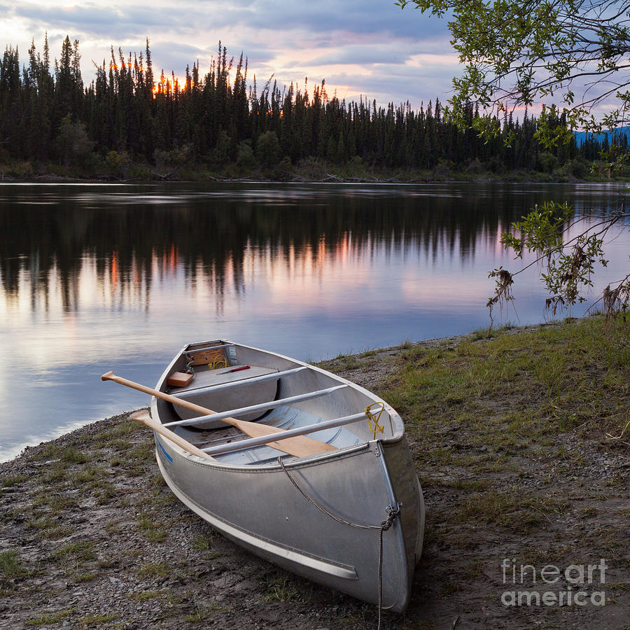 Nature Photograph - Sunset sky and canoe at Teslin River Yukon Canada by Stephan Pietzko