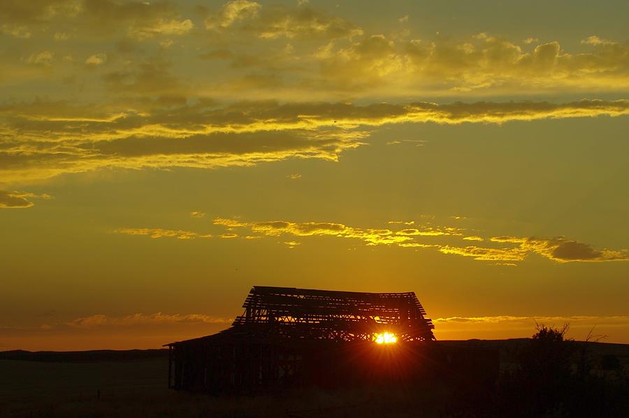 Sunset Through An Old Barn Photograph by Jeff Swan