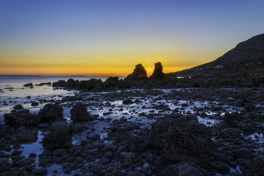 Sunset Photograph - Sunset Through The Rocks by Ian Mitchell