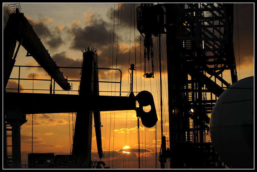 Sunset viewed from an oil rig w border Photograph by Bradford Martin