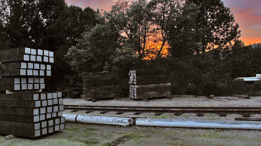 Sunset with railroad ties Photograph by Larry Darnell