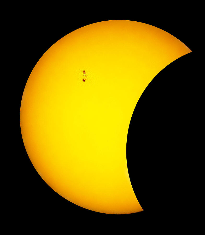 Sunspots During Partial Eclipse.    Photograph by Chris  Kusik