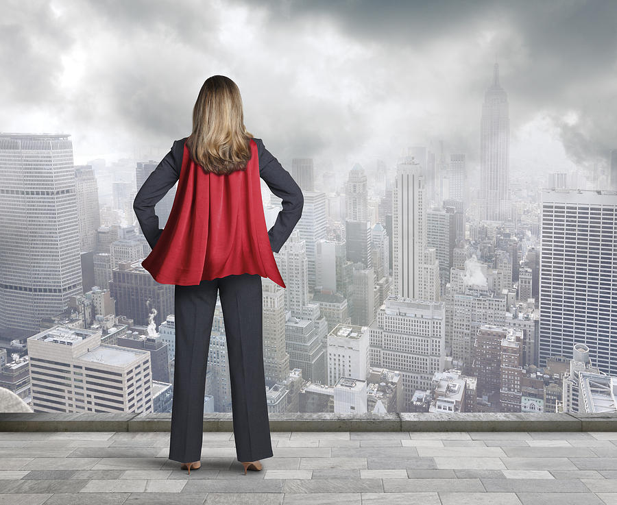 Superhero Businesswoman Wearing Red Cape Looking At Big City Photograph by Dny59
