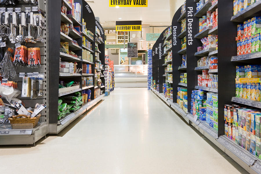 Supermarket aisle Photograph by Image Source