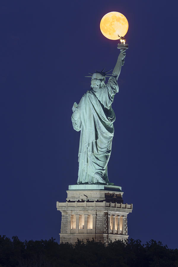 Statue Of Liberty Photograph - Supermoon Illuminates New York City by Susan Candelario