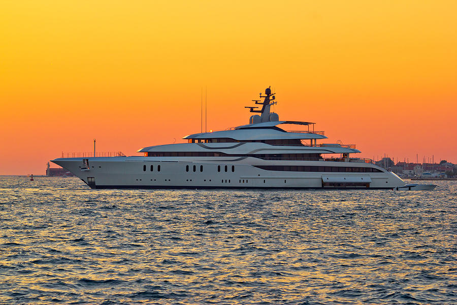 Superyacht on yellow sunset view Photograph by Brch Photography