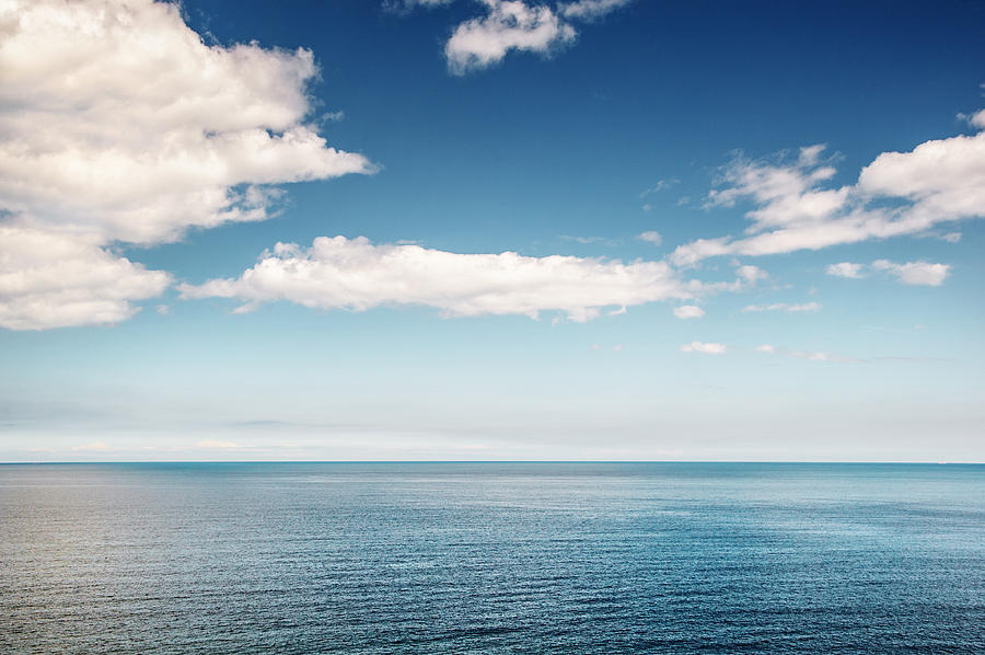 Surface of calm sea on a sunny day Photograph by Ulrike Schmitt-Hartmann