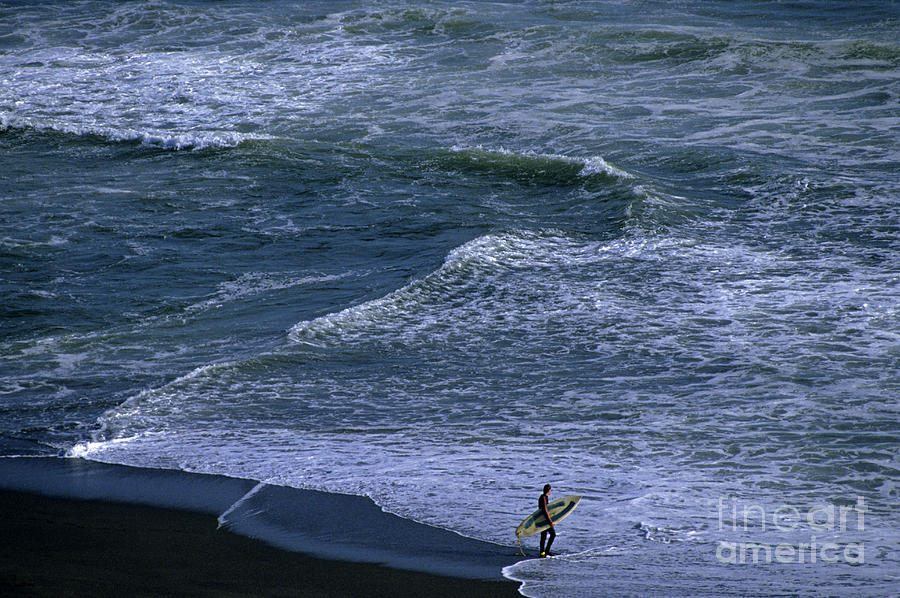 Nature Photograph - Surfer along shoreline by Jim Corwin
