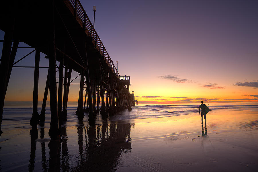 Surfer at Sunset Photograph by Peter Tellone