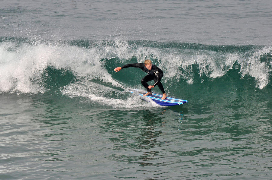 Surfer takes a wave sideways Photograph by Diane Lent