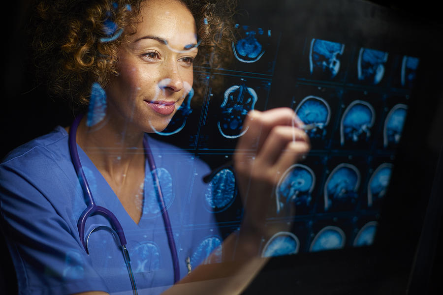 Surgeon With Mri Scans Photograph by Sturti Surgeon With Mri Scans Photograph by Sturti