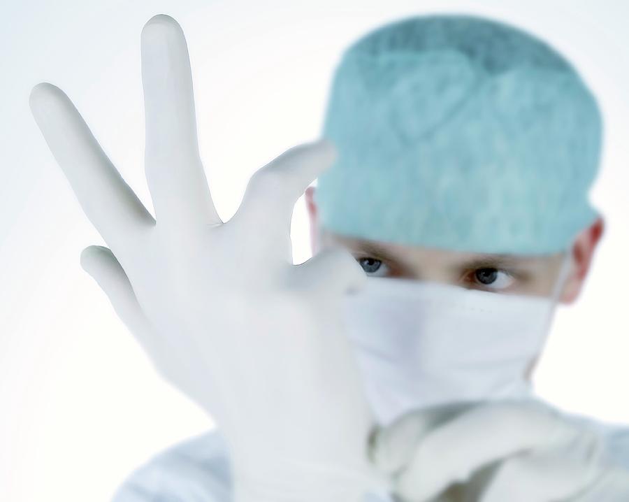Surgeons Glove Photograph by Pascal Broze/reporters/science Photo Library
