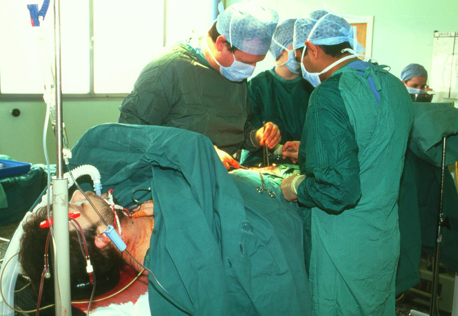 Surgeons Performing A Kidney Transplant Operation Photograph by Antonia Reeve/science Photo Library