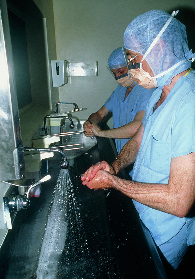 Surgeons Scrubbing Hands Before Operation Photograph by Mike Devlin/science Photo Library