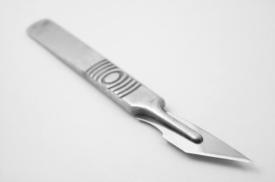 Surgical scalpel (focus on blade) Photograph by Dan_chippendale