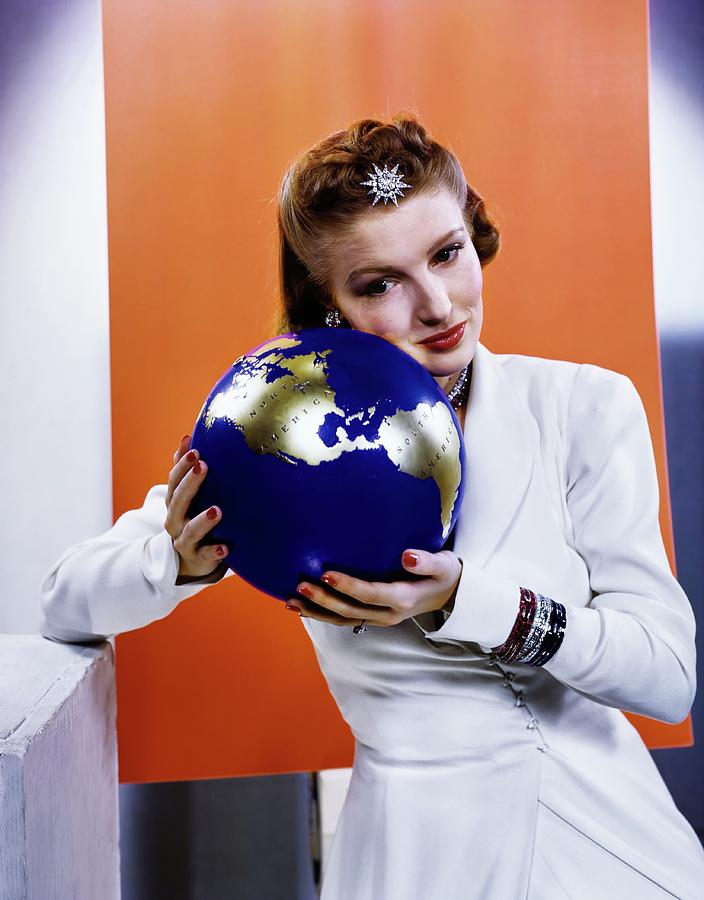 Susan Shaw Wearing Jewellery While Holding A Globe Photograph by Edward Steichen