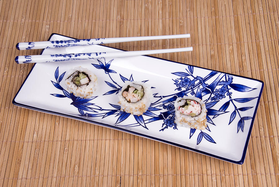 Sushi Photograph - Sushi rolls on ceramic dishware by Joe Belanger