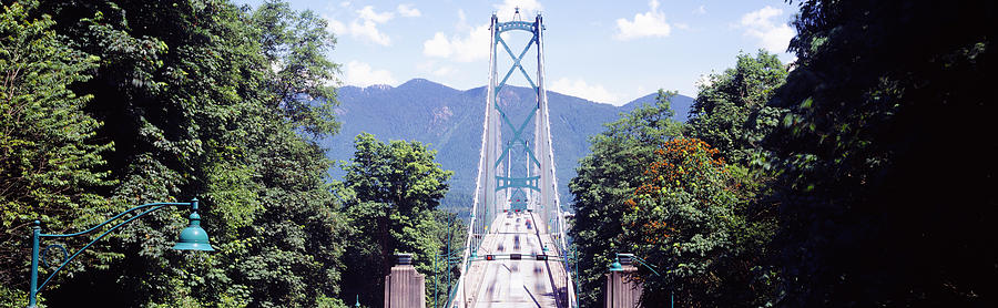 Architecture Photograph - Suspension Bridge With Mountain by Panoramic Images